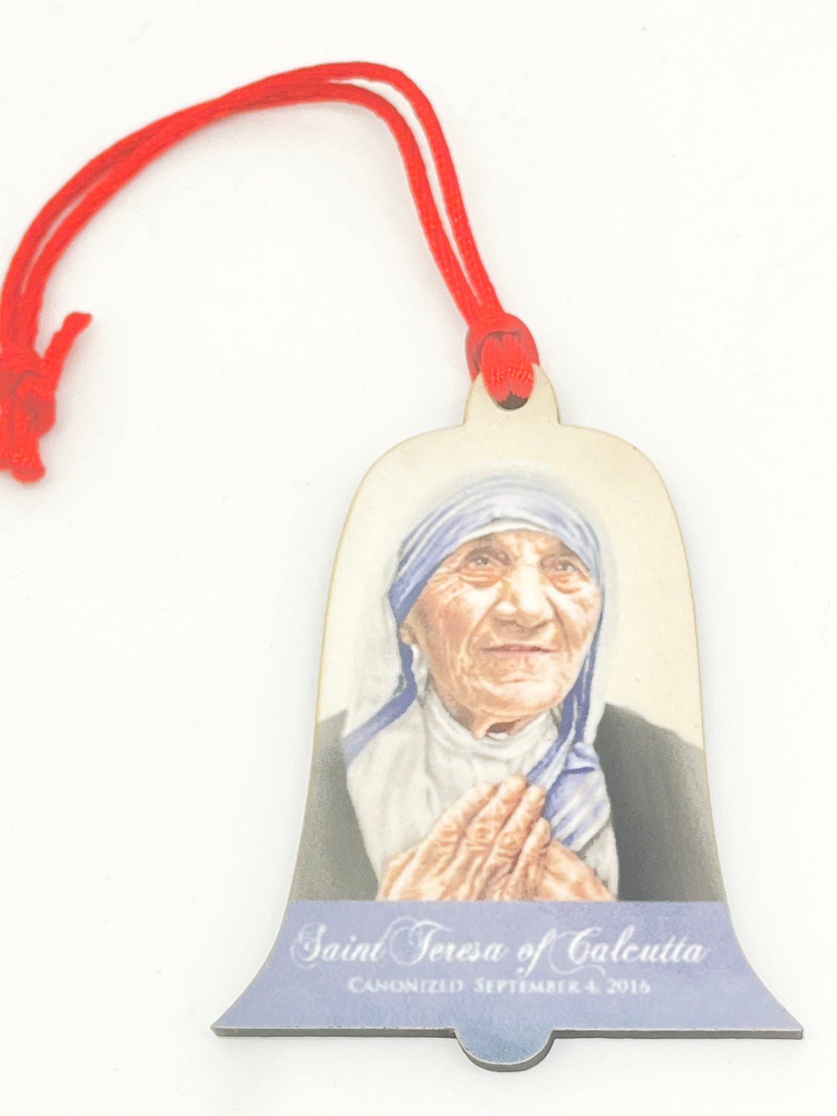 Wood ornament featuring St. Mother Teresa of Calcutta with prayerful pose and red hanging cord, 2 3/4 inches tall