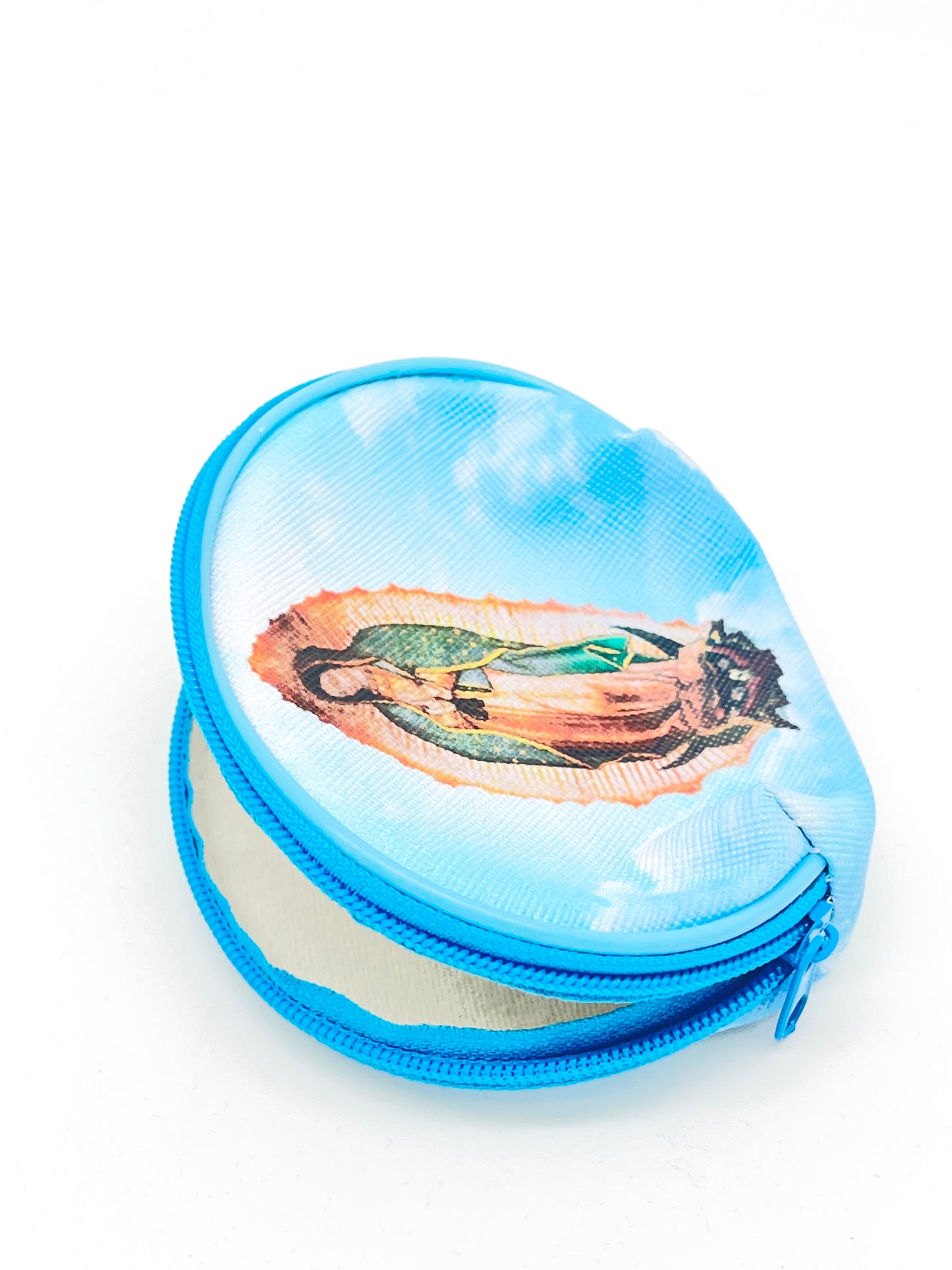 Large round rosary pouch with zipper closure featuring Our Lady of Guadalupe image on blue sky background