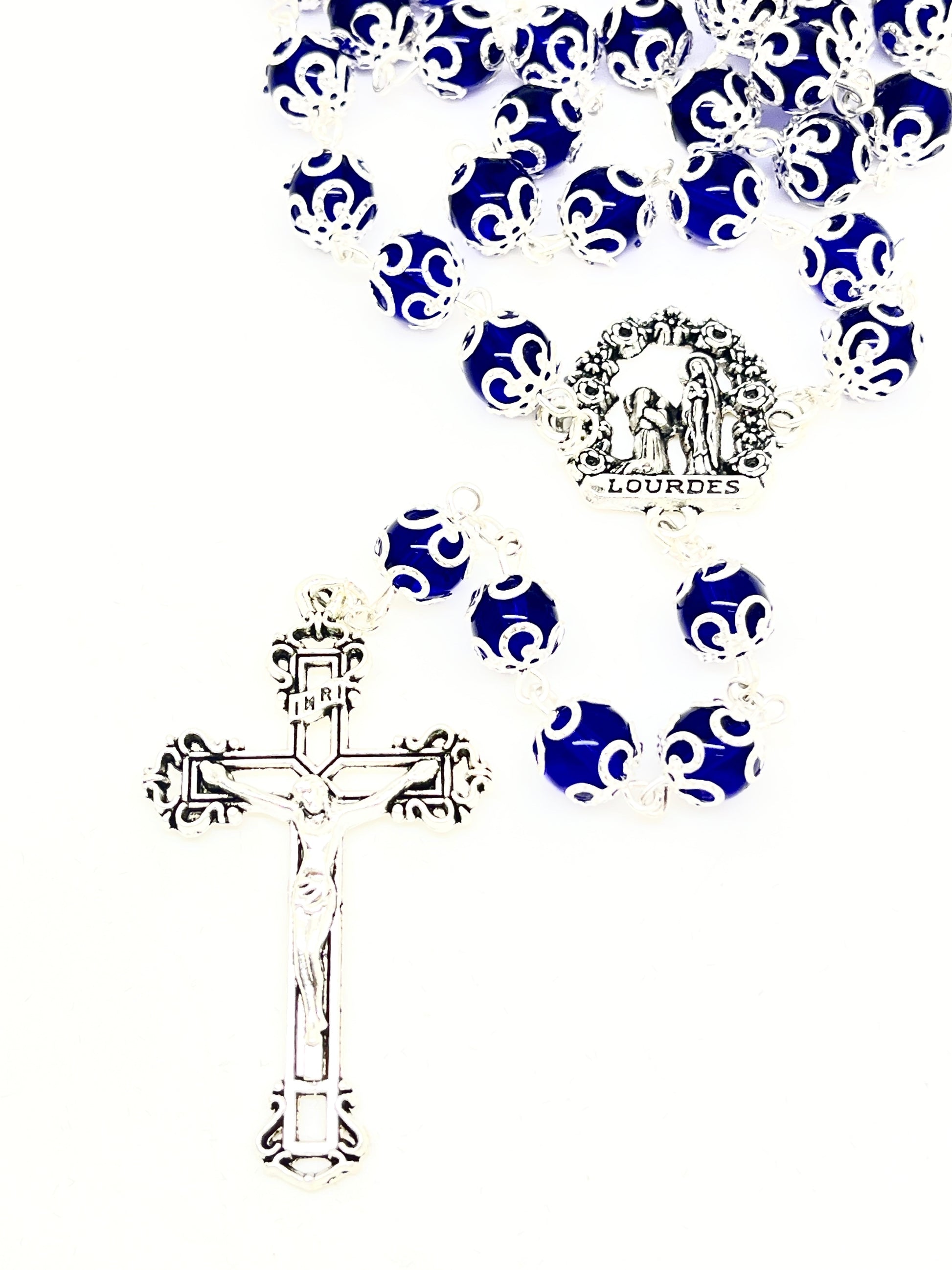 Lourdes blue glass doubled capped rosary with silver Bernadette centerpiece and detailed crucifix pendant.
