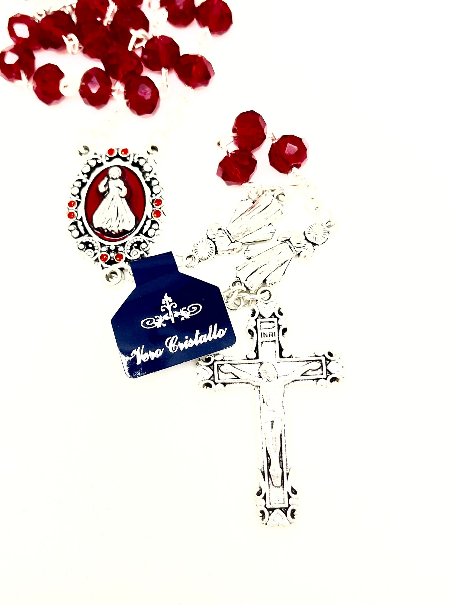 Red crystal Divine Mercy rosary with silver crucifix and red enamel centerpiece beads on white background