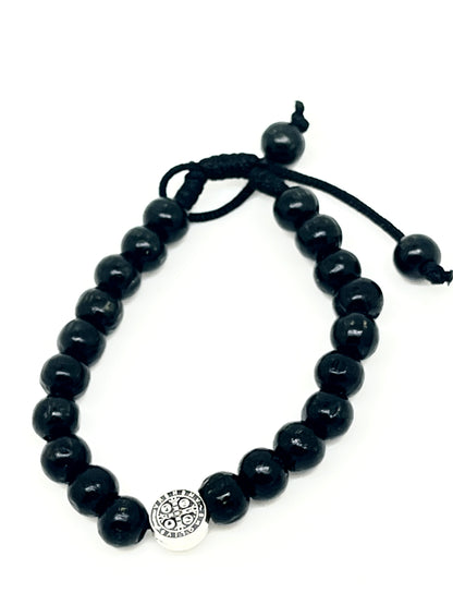 Black wood bead bracelet with adjustable slip knot and silver-toned St. Benedict medal centerpiece detailing