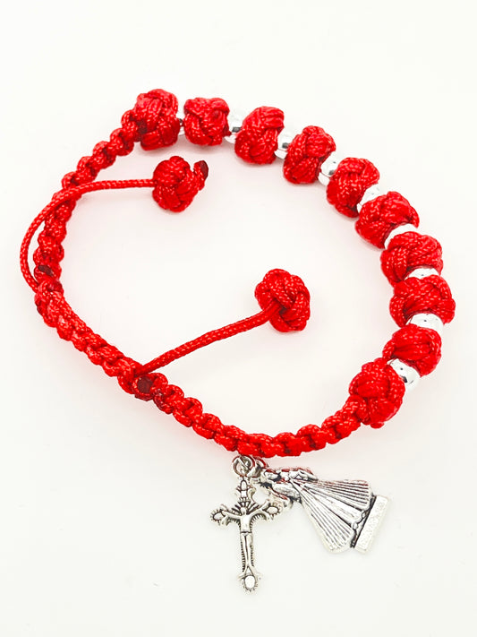 Adjustable red knotted cord rosary bracelet with Divine Mercy charm and silver crucifix pendant.