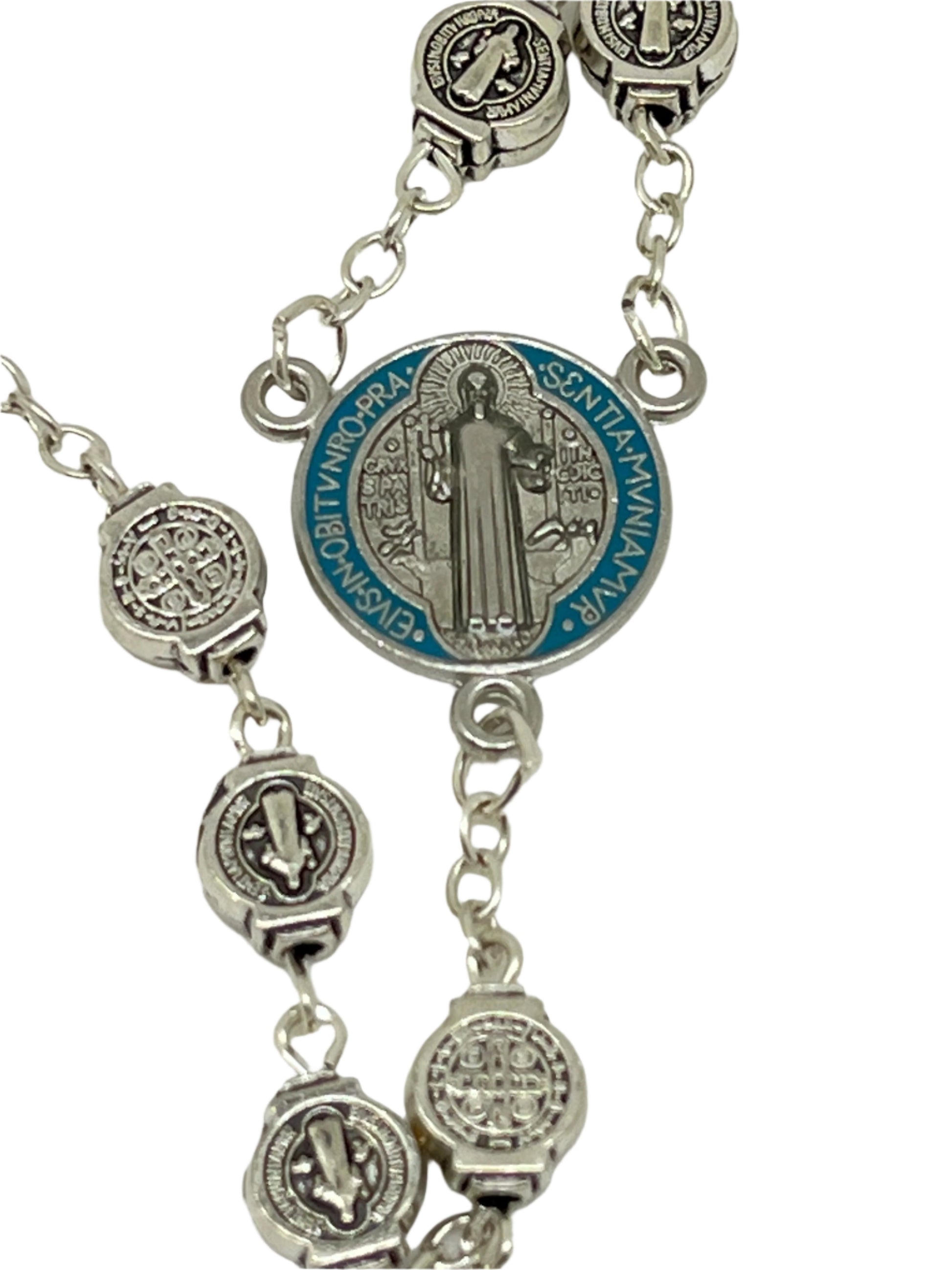 St. Benedict Rosary with silver medals, color-splashed centerpiece, black enamel and silver Benedict crucifix, 23 inches long.