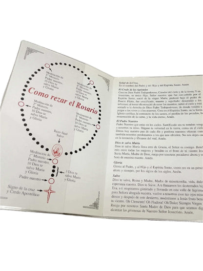 Open booklet showing detailed instructions for praying the Holy Rosary with Letanías de Loreto prayers included