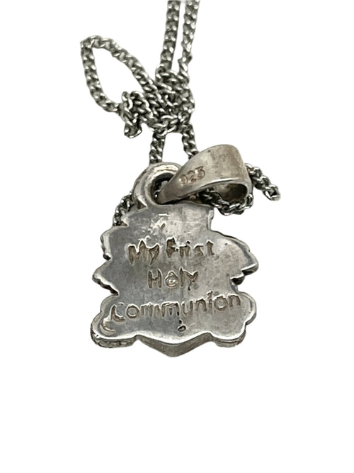 Handmade sterling silver First Communion pendant with engraved "My first Holy Communion" text, 1/2 inch size.