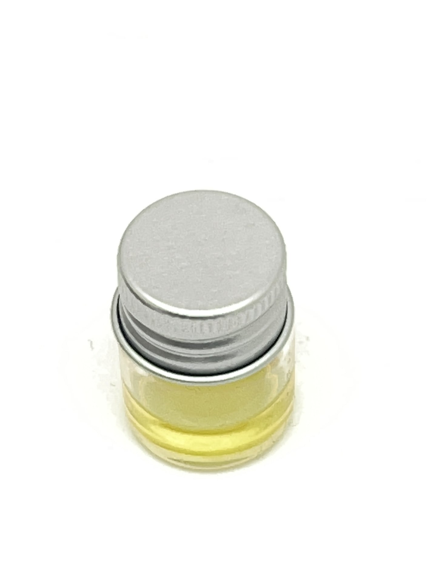 Small clear glass vial with silver screw cap containing pale yellow Saint Michael relic oil liquid