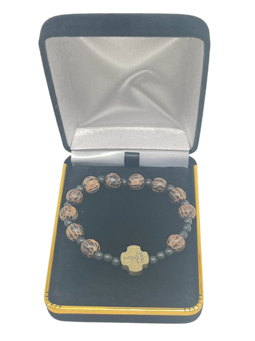 Striped wood children’s rosary bracelet with 8mm round beads and cross centerpiece in black velvet gift box
