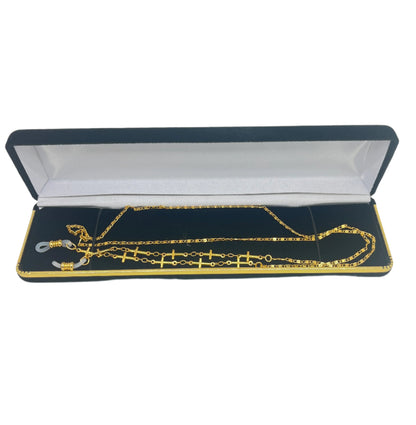 Gold-tone Cross Link Eyeglass Holder Chain displayed in black and white lined jewelry box with silicone loops on ends