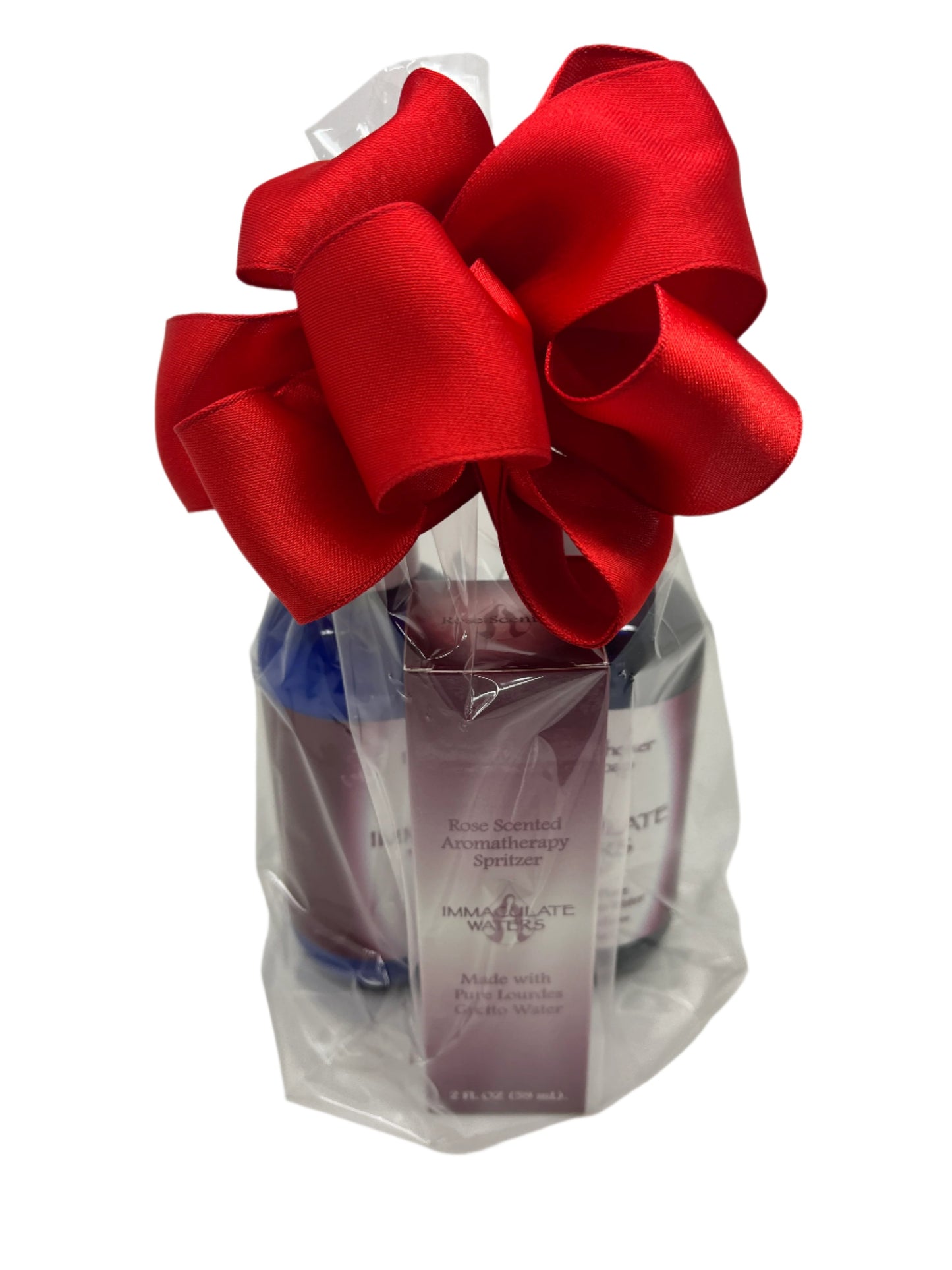 Immaculate Waters Rose Kit with lavender lotion, soap, and spritzer in clear bag tied with large red bow