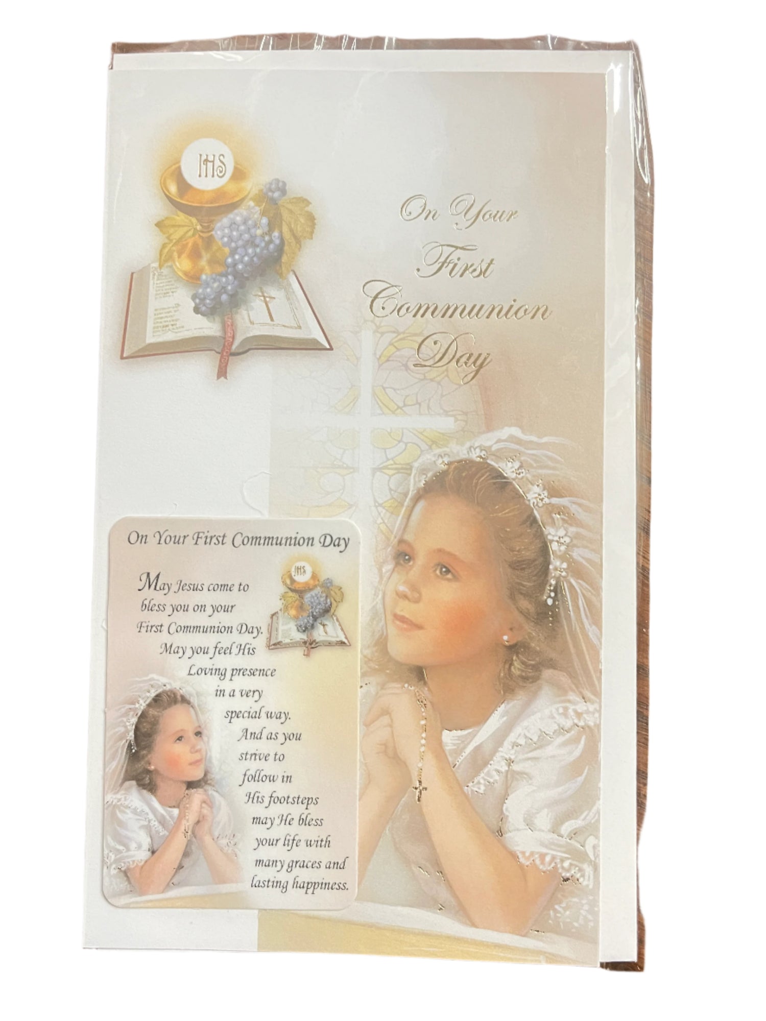 First Communion card for a girl with prayer, religious symbols, and holy card blessing on her special day