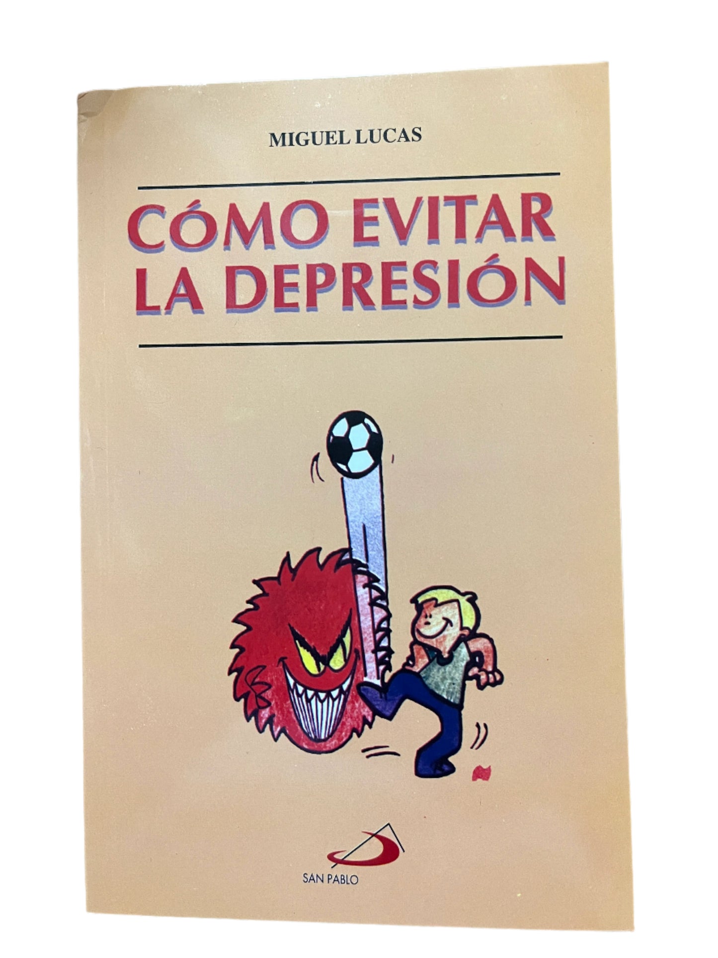 Como Evitar La Depresion book by Miguel Lucas with illustration of person kicking a red angry creature holding a soccer ball