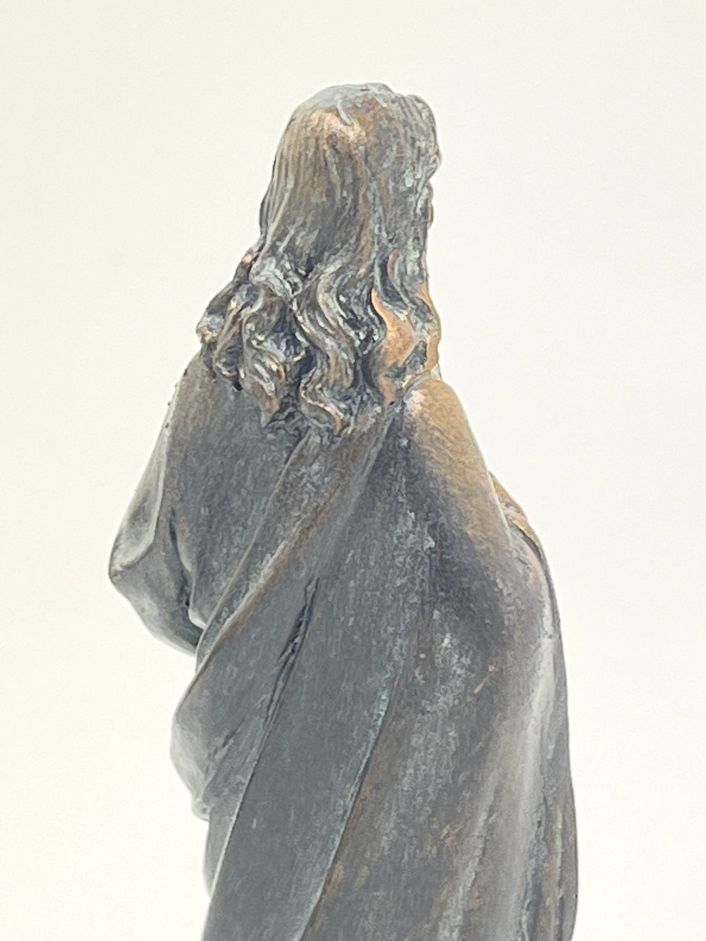 4-inch Sacred Heart of Jesus statue with bronze patina finish, showing detailed hair and robe from rear view
