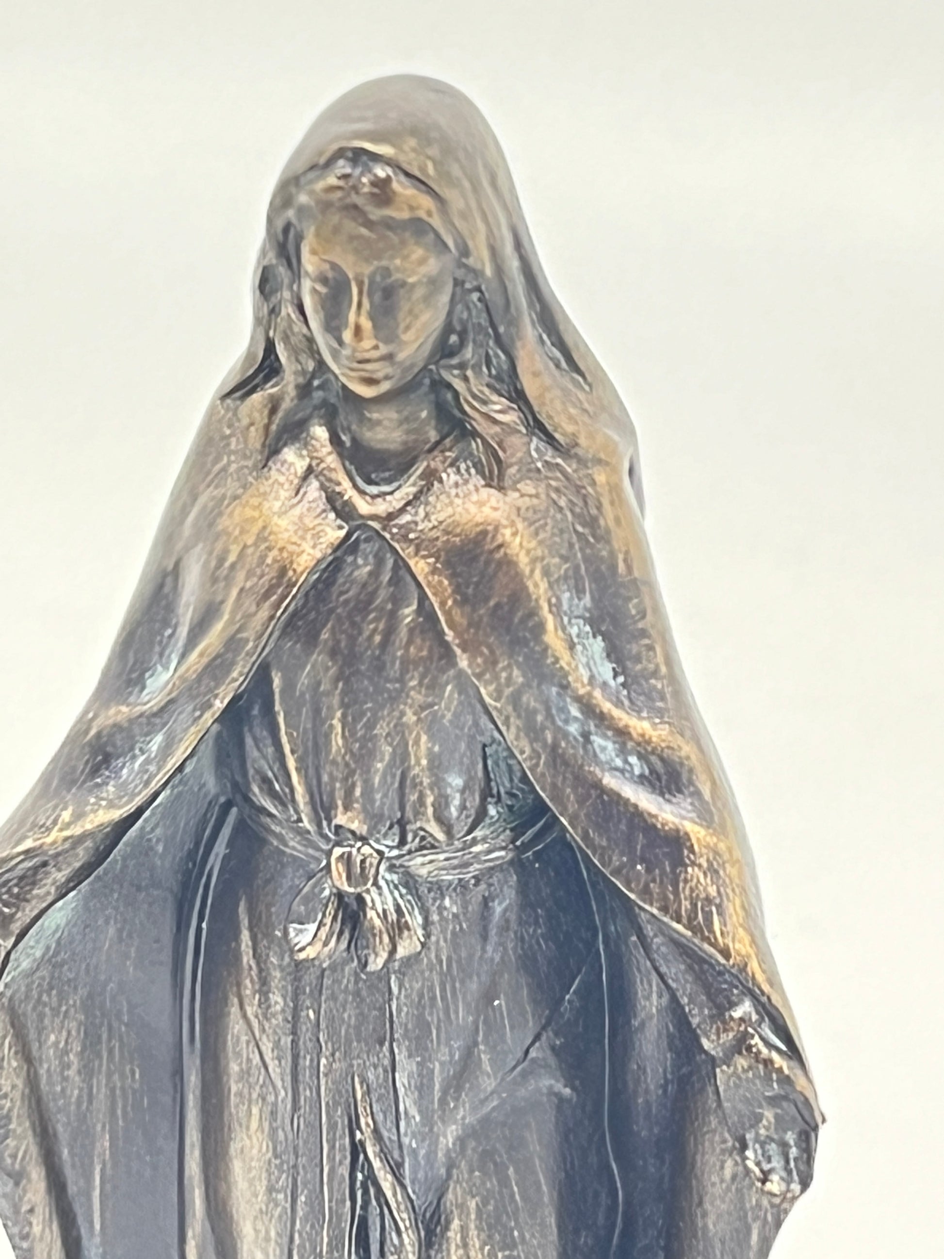 Our Lady of Grace 4" tall bronze patina statue depicting the Blessed Mother with flowing robe and serene expression