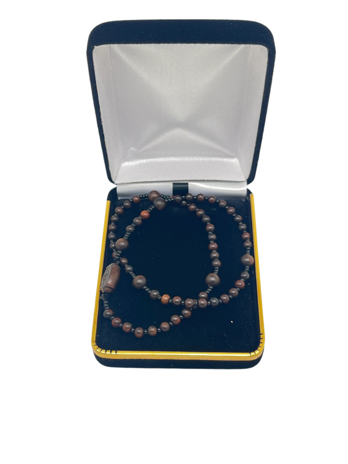 Jujube wood twisting rosary bracelet with 4mm beads, displayed in black and gold velvet presentation box.