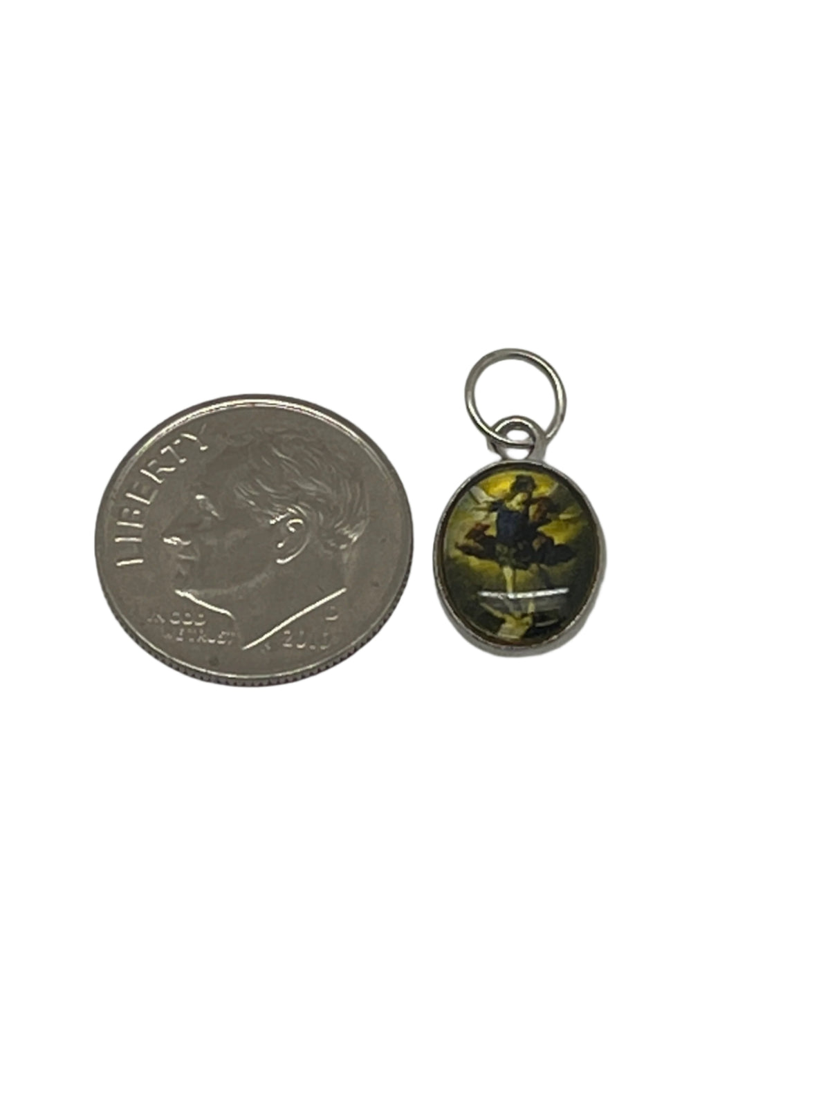 Small oval St. Michael Medal charm with detailed image, perfect for bracelets or anklets, shown beside dime for scale.