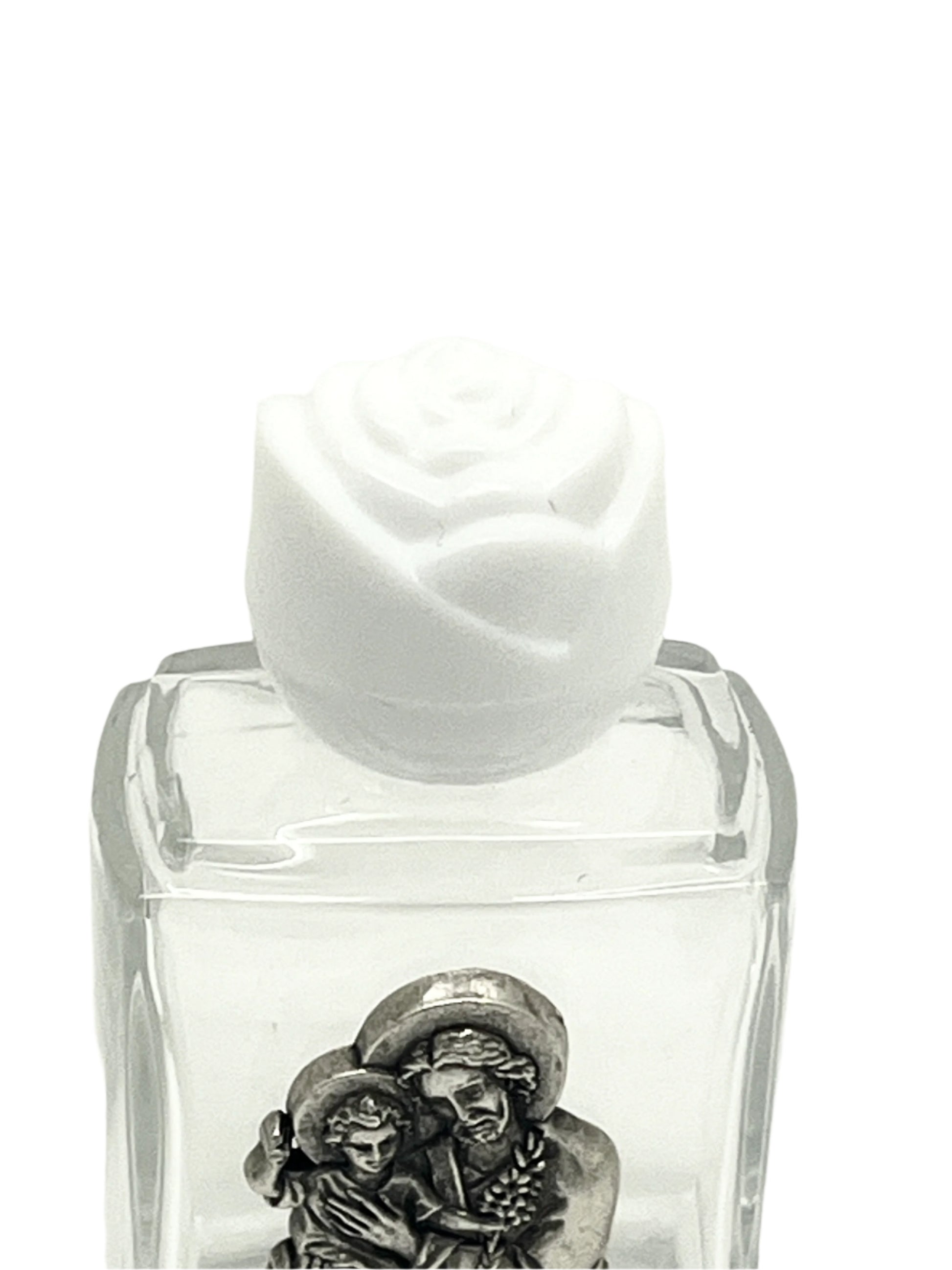 Small clear glass holy water bottle with pewter St. Joseph image and white rose-shaped cap