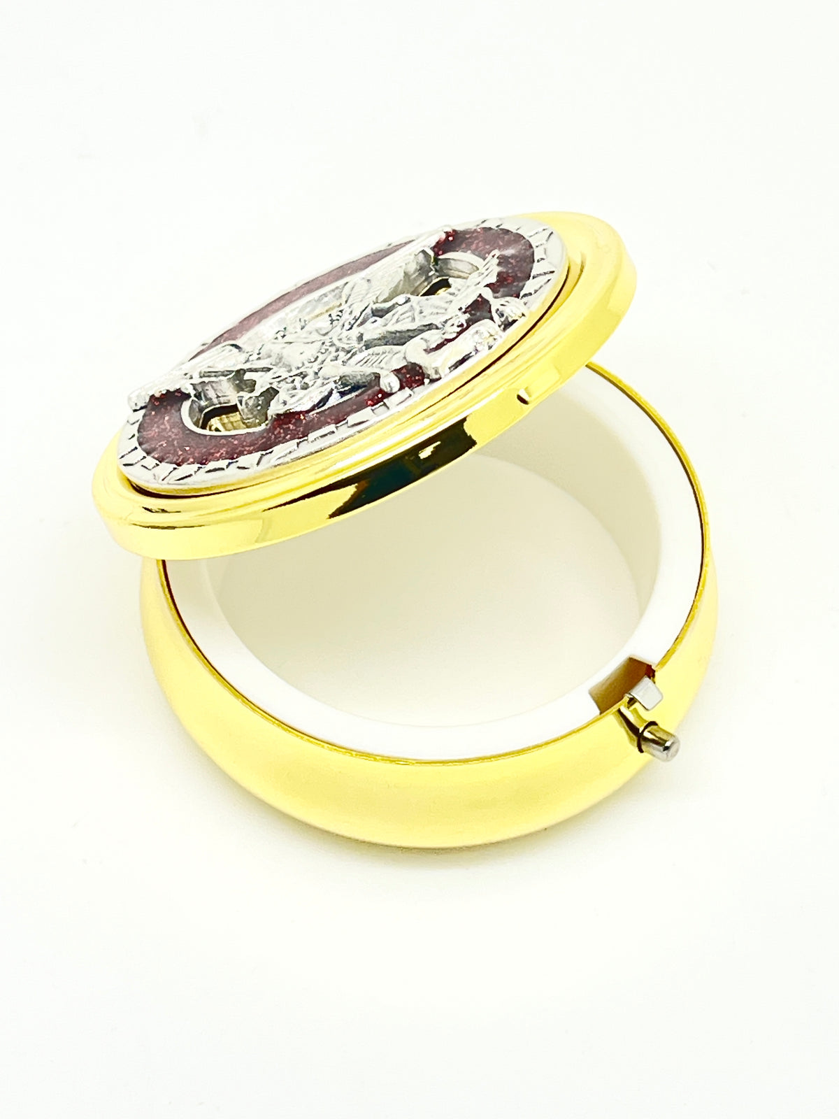 2 1/8" gold pyx with pewter St. Michael medallion, red enamel accents, and white plastic lining inside