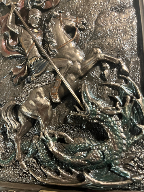 9" St. George wall plaque depicting Saint George on horseback slaying the dragon with detailed textured background