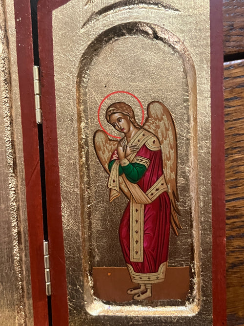 Part of Holy Family Greek Icon Triptych featuring angel in red and green robes with gold wings and halo on gold background