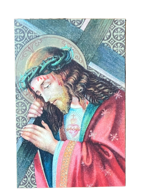 Holy card depicting Jesus carrying the cross wearing crown of thorns and red robe with sacred heart visible