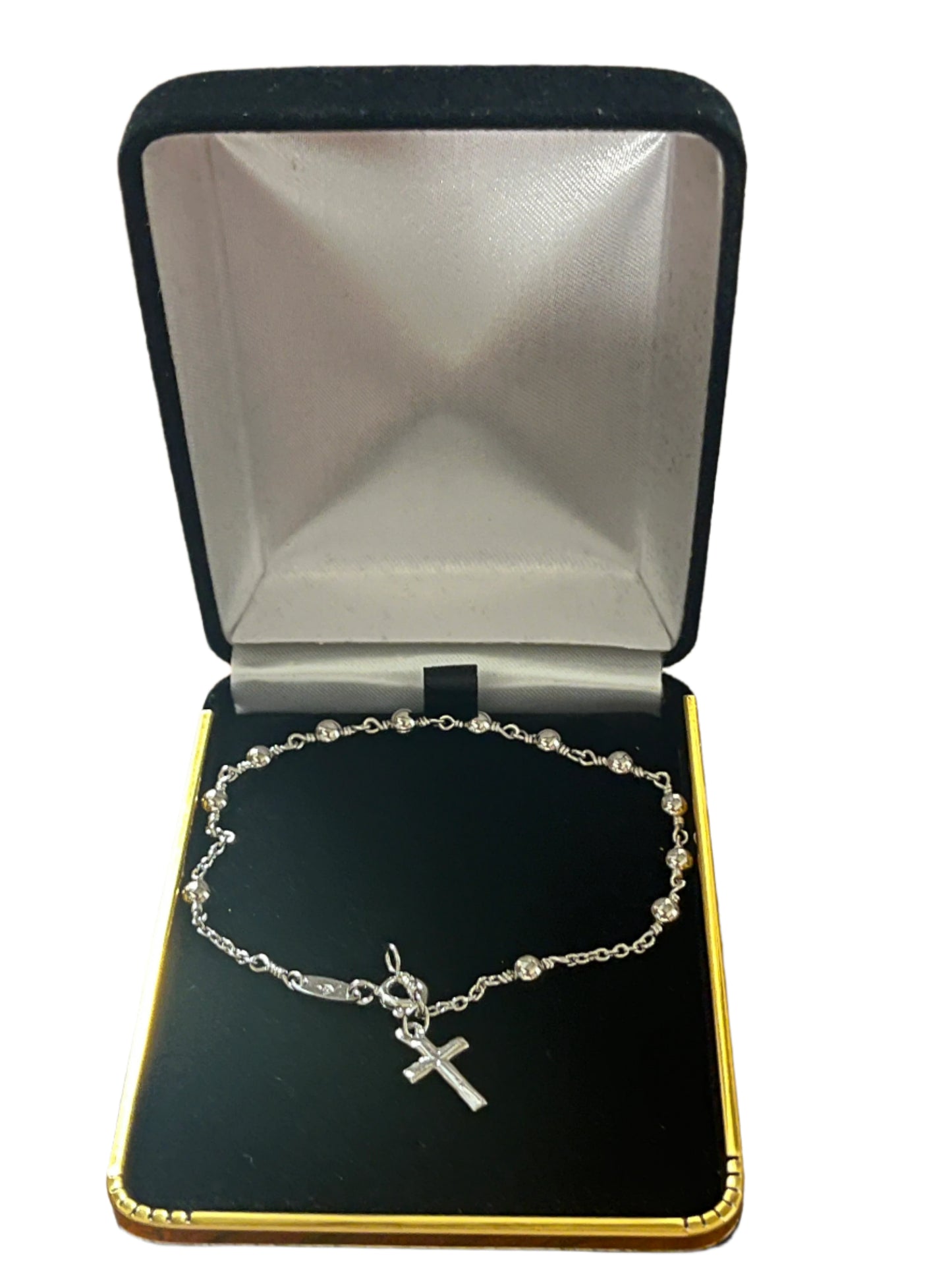 Rhodium plated brass rosary bracelet with small beads and cross charm displayed in black and gold gift box