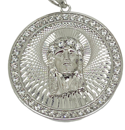 1 3/8" rhodium plated brass pendant featuring the Holy Face of Jesus with detailed pitted and swiss cut design