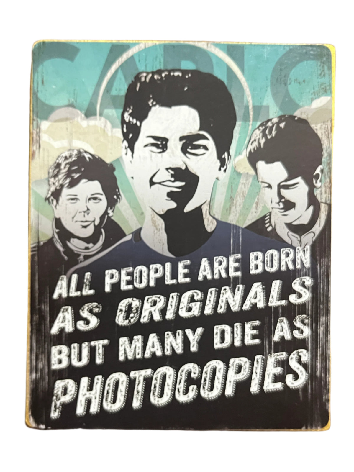 4.5" wooden block with black and white portraits of Carlo Acutis and quote on originality against blue background