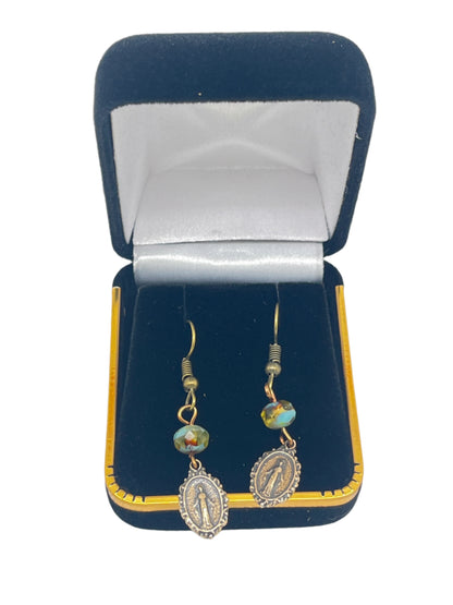 Brass Miraculous Medal earrings with turquoise Czech pearls displayed in black velvet gift box with gold trim