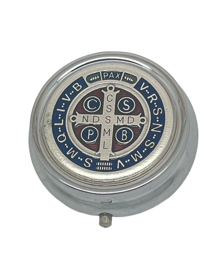 4" round metal Saint Benedict box with detailed blue and red enamel and engraved cross design on lid