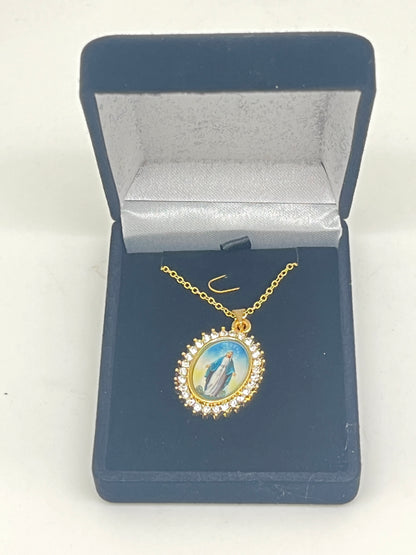20" gold Our Lady of Grace necklace with oval crystal-embellished pendant in navy blue velvet gift box