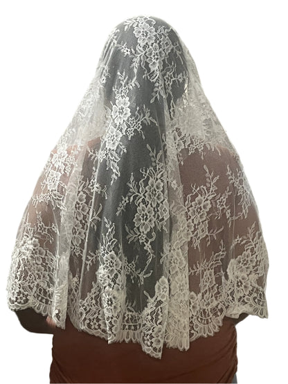 61" white Gabriela half circle lace mantilla veil with floral motifs and scalloped edge worn over head and shoulders