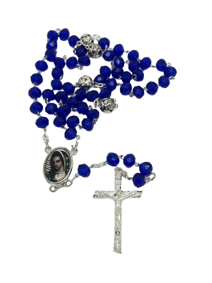 Our Lady of Guadalupe rosary with deep blue crystal beads, silver-toned crucifix, and detailed centerpiece image