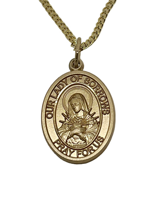 3/4" gold filled Our Lady of Sorrows oval medal pendant on 18" rhodium curb chain with lobster clasp closure
