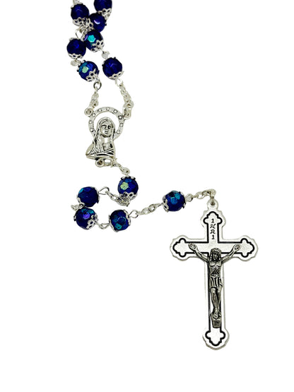 Blue crystal cut and silver capped rosary featuring Madonna centerpiece and detailed silver crucifix pendant.
