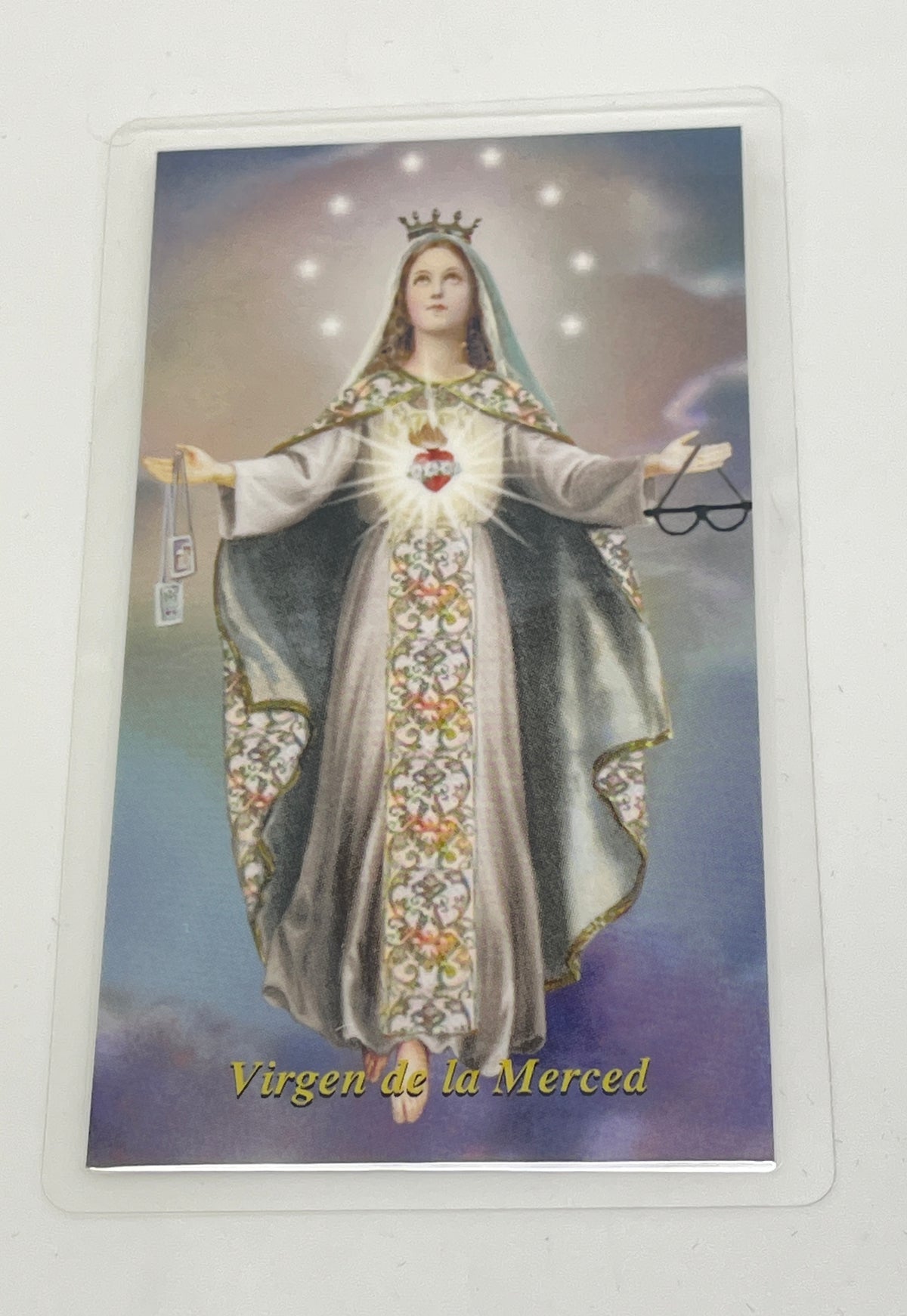 4" x 6" laminated holy card of Virgin de la Merced with detailed sacred heart image and prayer on back