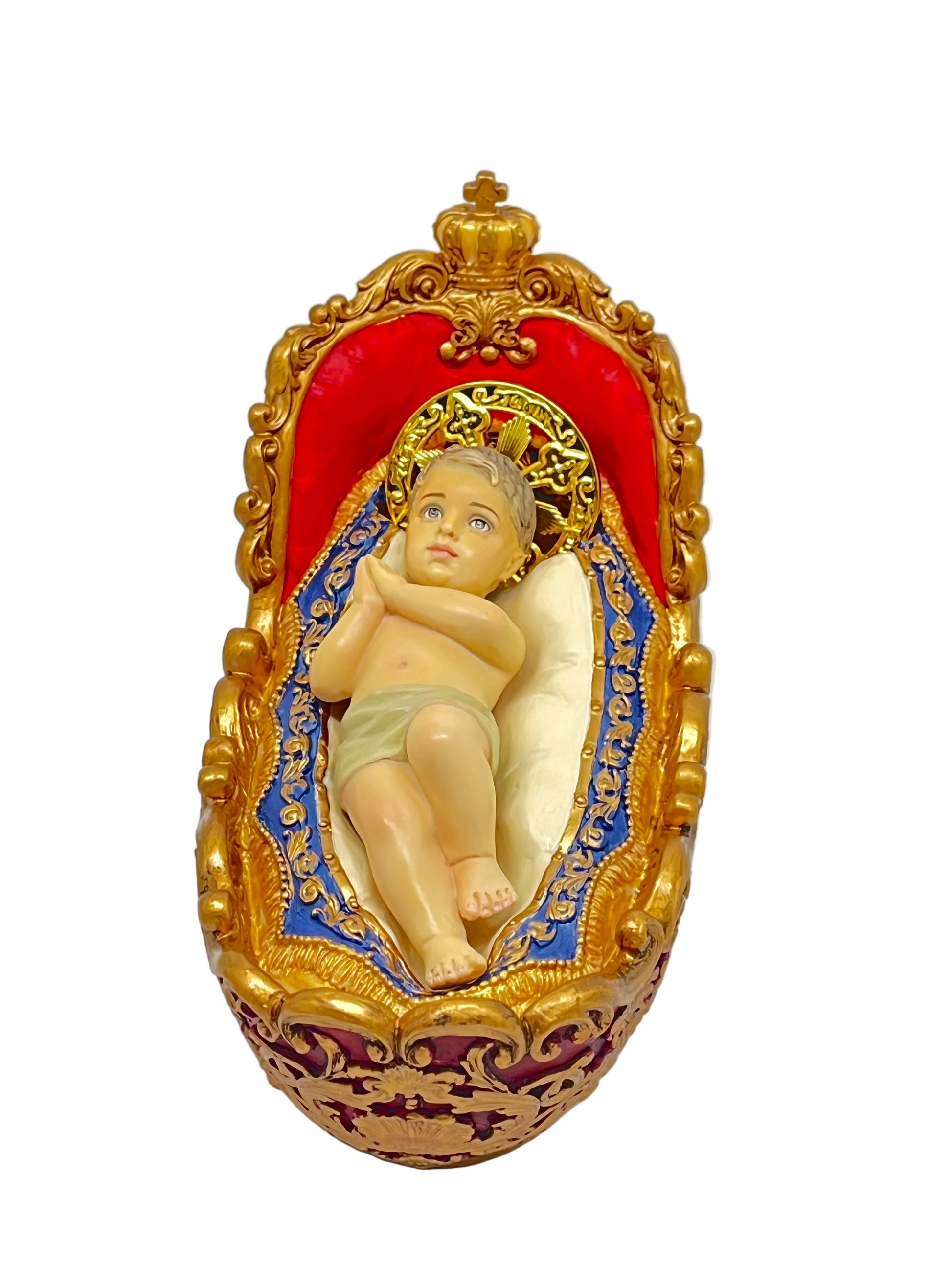 3 7/8" Advent Infant Jesus figurine with gold halo lying in ornate hand-painted manger with red and blue accents