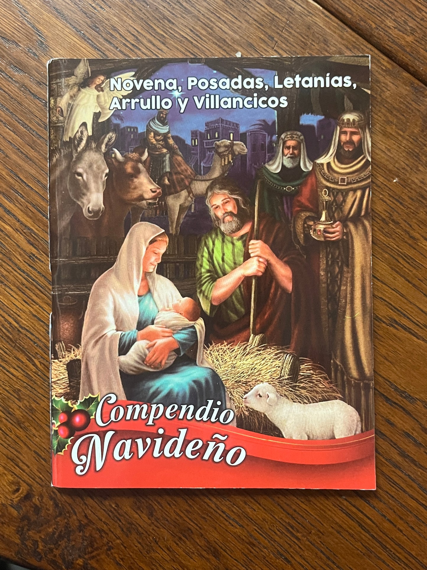 Christmas compendium book featuring novena, posadas, litanies, lullabies, and carols with nativity scene illustration on cover.