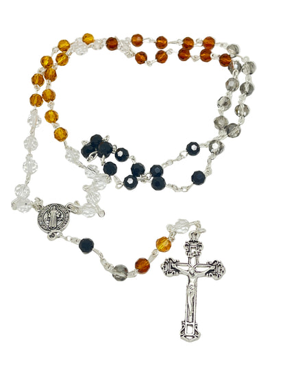 Multi-color Saint Benedict rosary with jet black, amber, brown, and clear crystals, silver crucifix, and medal centerpiece