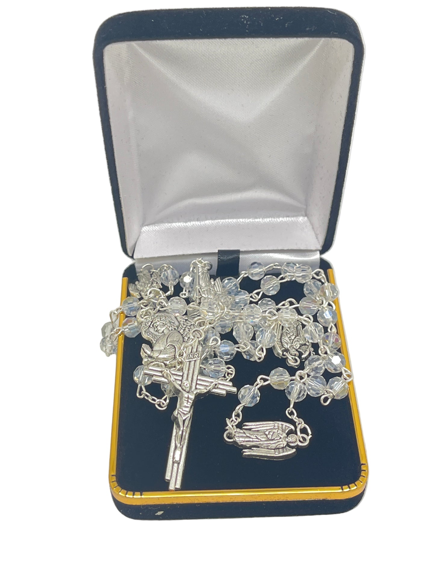 Clear Crystal Archangel rosary with silver crucifix and Archangel centerpiece displayed in navy velvet and satin-lined box
