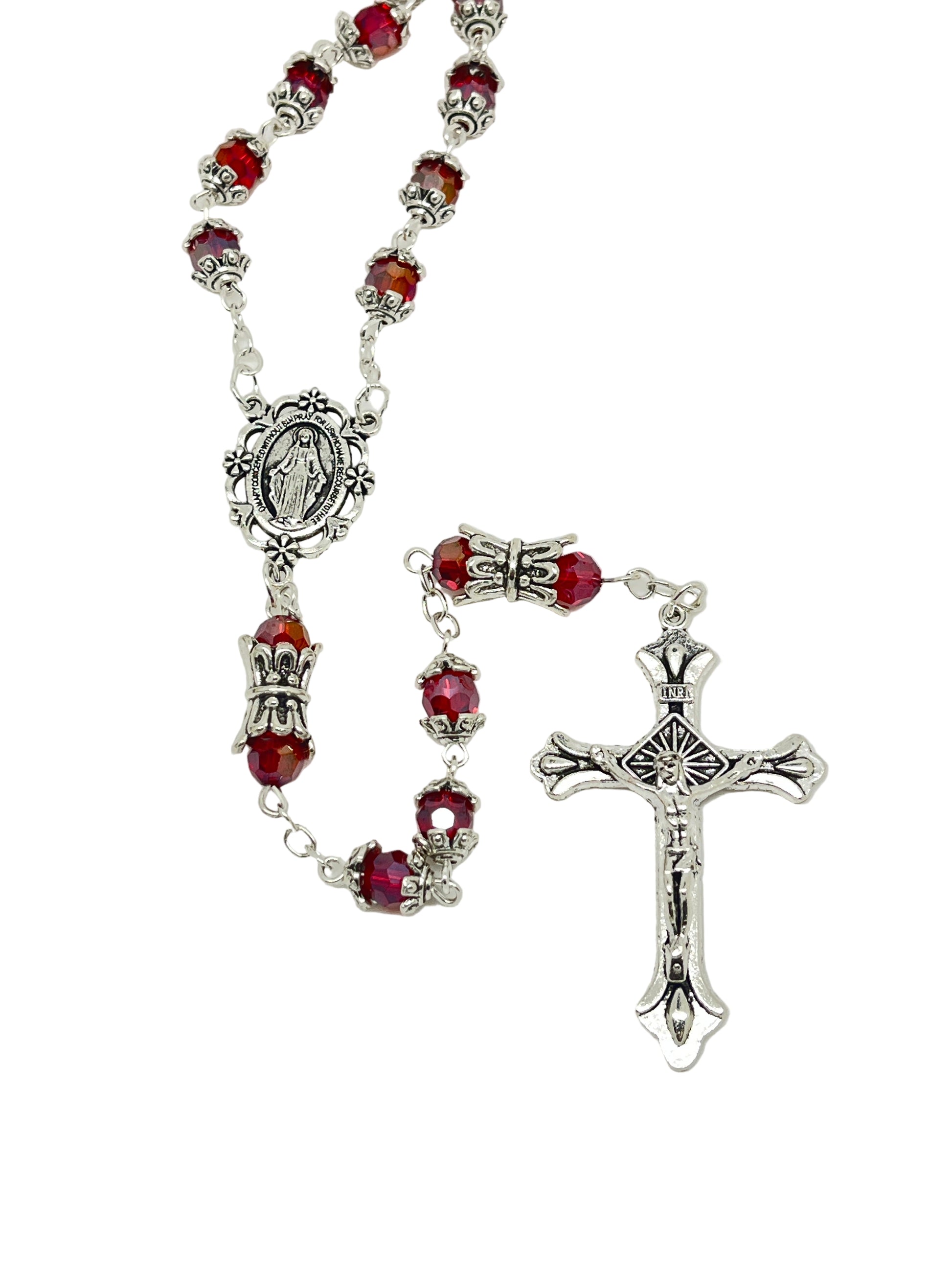 Red capped crystal bead rosary with silver miraculous medal crowns and detailed silver crucifix pendant