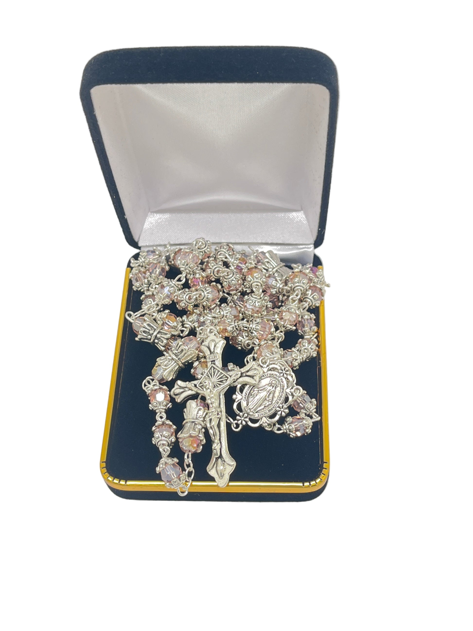 Pink capped crystal bead rosary with silver miraculous medal crowns and center, displayed in black velvet jewelry box