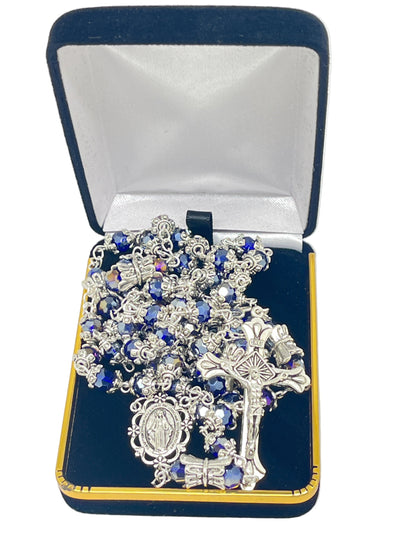 Blue crystal bead rosary with silver caps, crowned Our Father beads, and silver Miraculous Medal centerpiece in velvet box