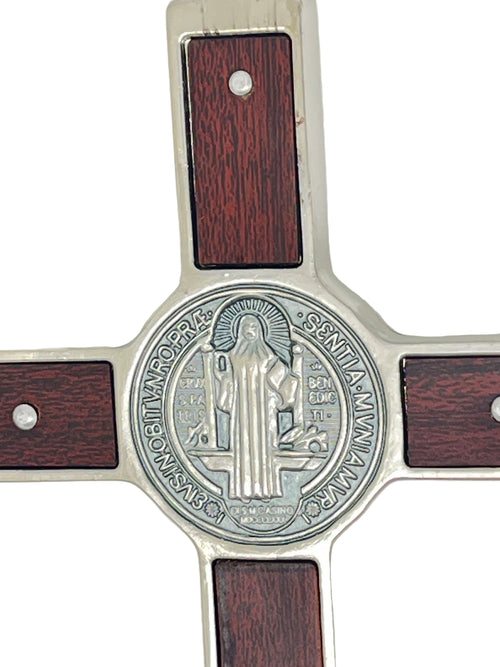 Close-up of Saint Benedict medal on metal and olive wood inlaid 7 1/2" wall crucifix with detailed engraving