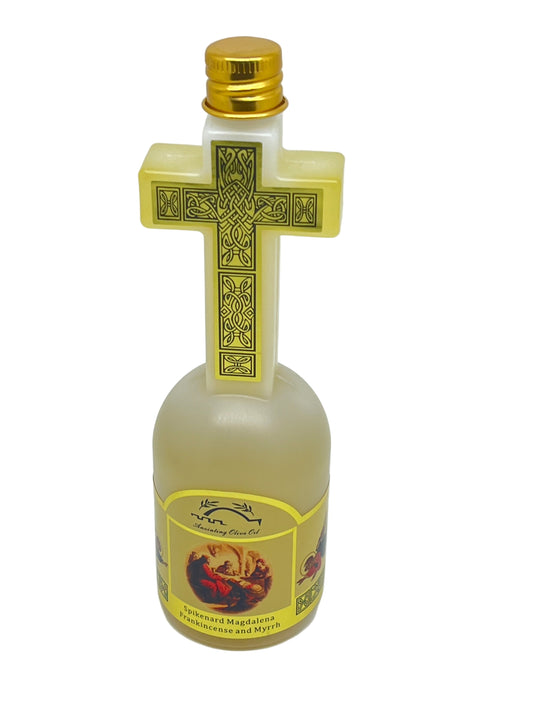 120 ml bottle of Jerusalem anointing oil with gold cross cap and label featuring Mary Magdalene and frankincense scent