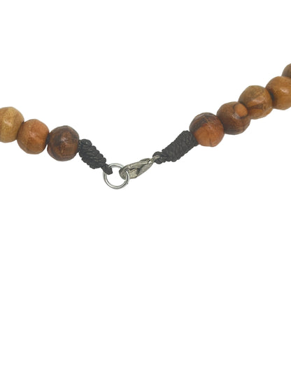 Close-up of handmade Olive Wood Rosary Necklace clasp with round wooden beads from Jerusalem’s Holy Land.