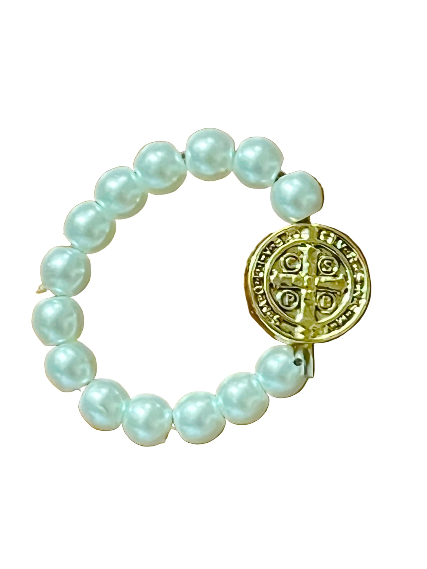 White bead stretch ring featuring a gold-toned Benedict medal, blending faith symbolism with elegant design