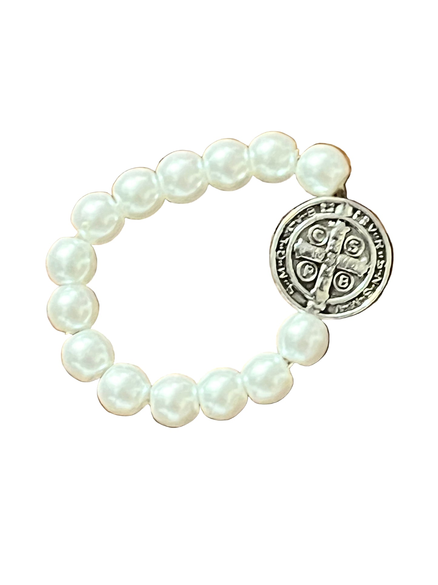 White and silver stretch ring with pearl-like beads and a detailed Benedict Medal charm for faith and protection