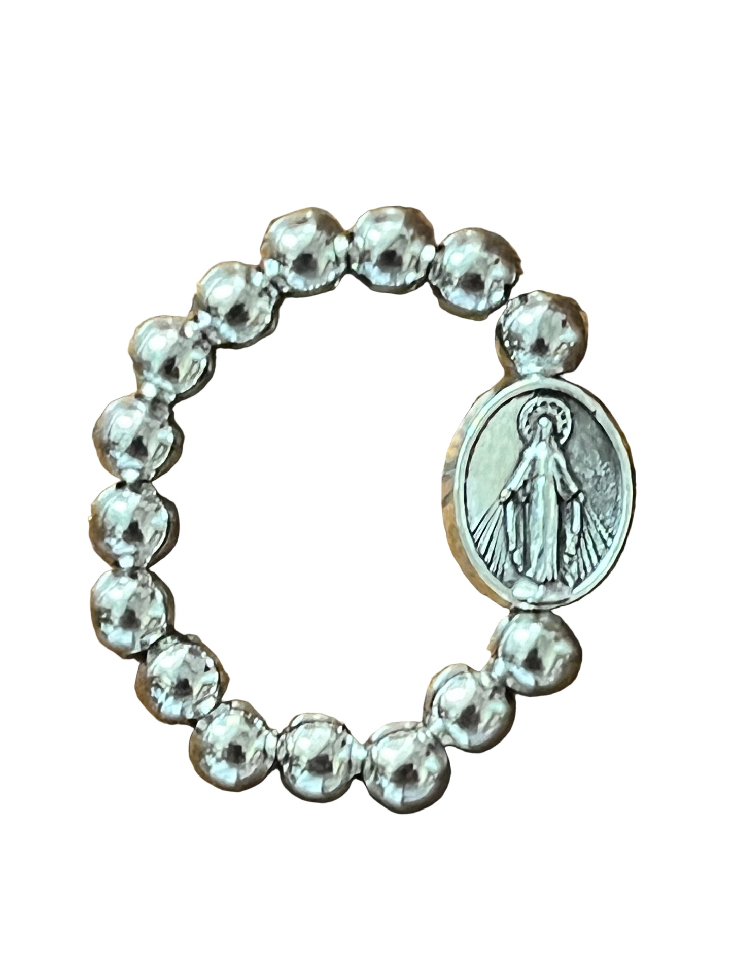Silver stretch ring with round beads and oval Miraculous Medal charm featuring Virgin Mary image on white background