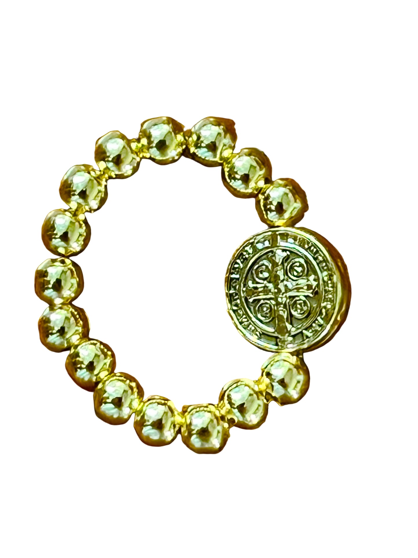 Gold stretch ring with round beads and detailed gold-tone Saint Benedict medal centerpiece on white background