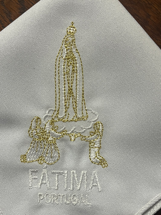 Embroidered white handkerchief with gold and white depiction of Our Lady of Fatima and kneeling angels with Fatima Portugal text